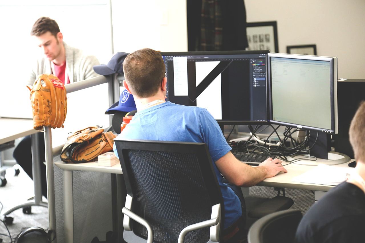 working at computer with baseball glove